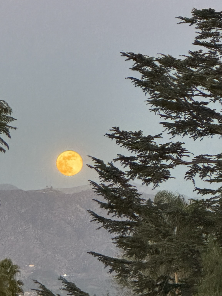 The full moon reflecting the fires