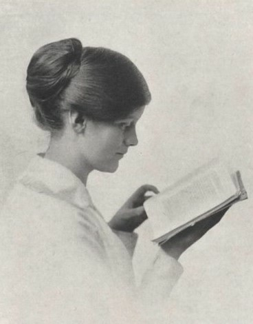 Photo of Marjorie Powell. She is a white woman reading a book.