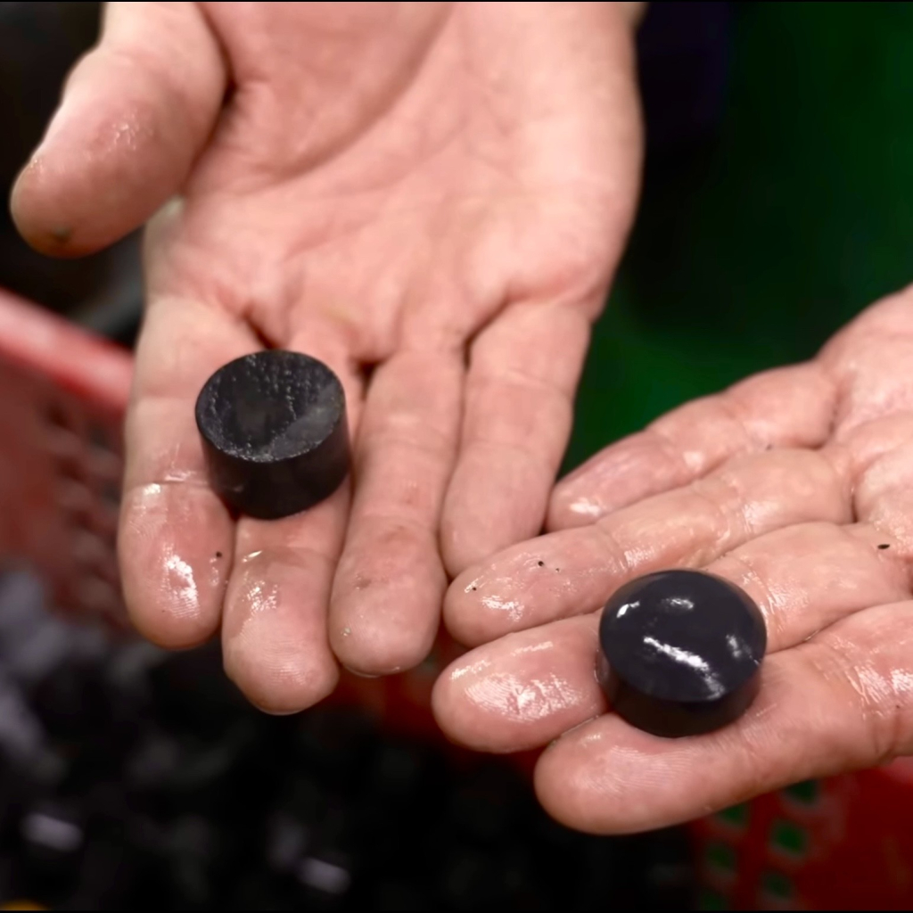 Black stones cut into Go pieces in Japan