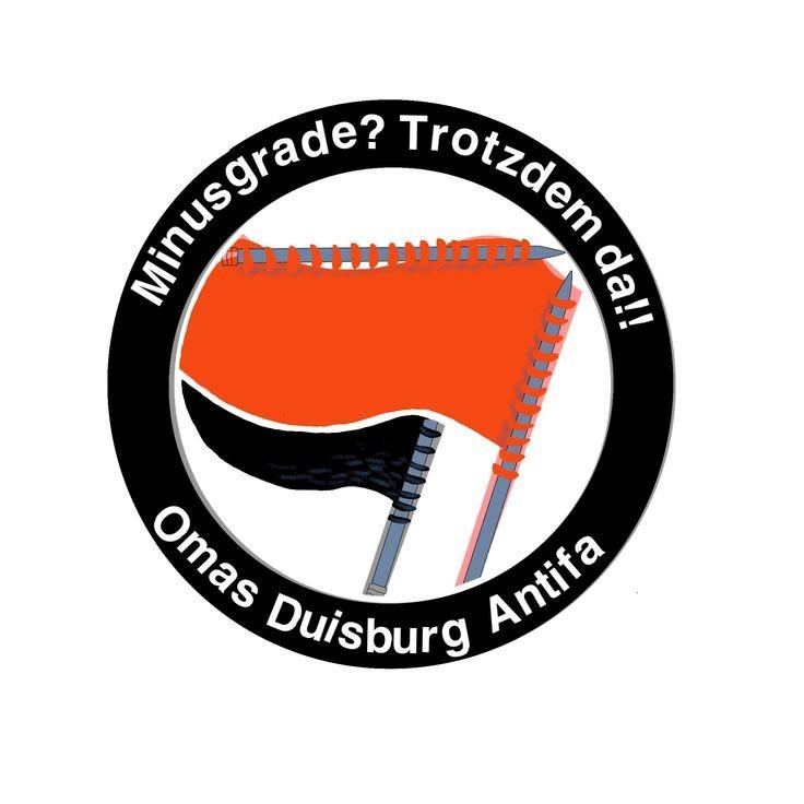 Die Antifa Flaggen als Strickzeug dargestellt, drumherum steht 
"Minusgrade? Trotzdem da!! Omas Duisburg Antifa