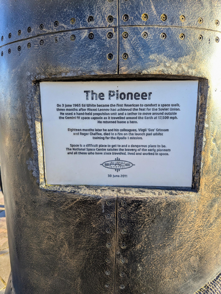 Photo of the plaque on "The Pioneer" sculpture.