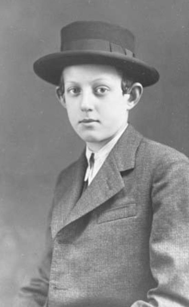 Black and white portrait of a man wearing a bowler hat and a formal suit.