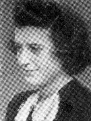 Black and white portrait of a woman looking to the side, dressed in a formal jacket.