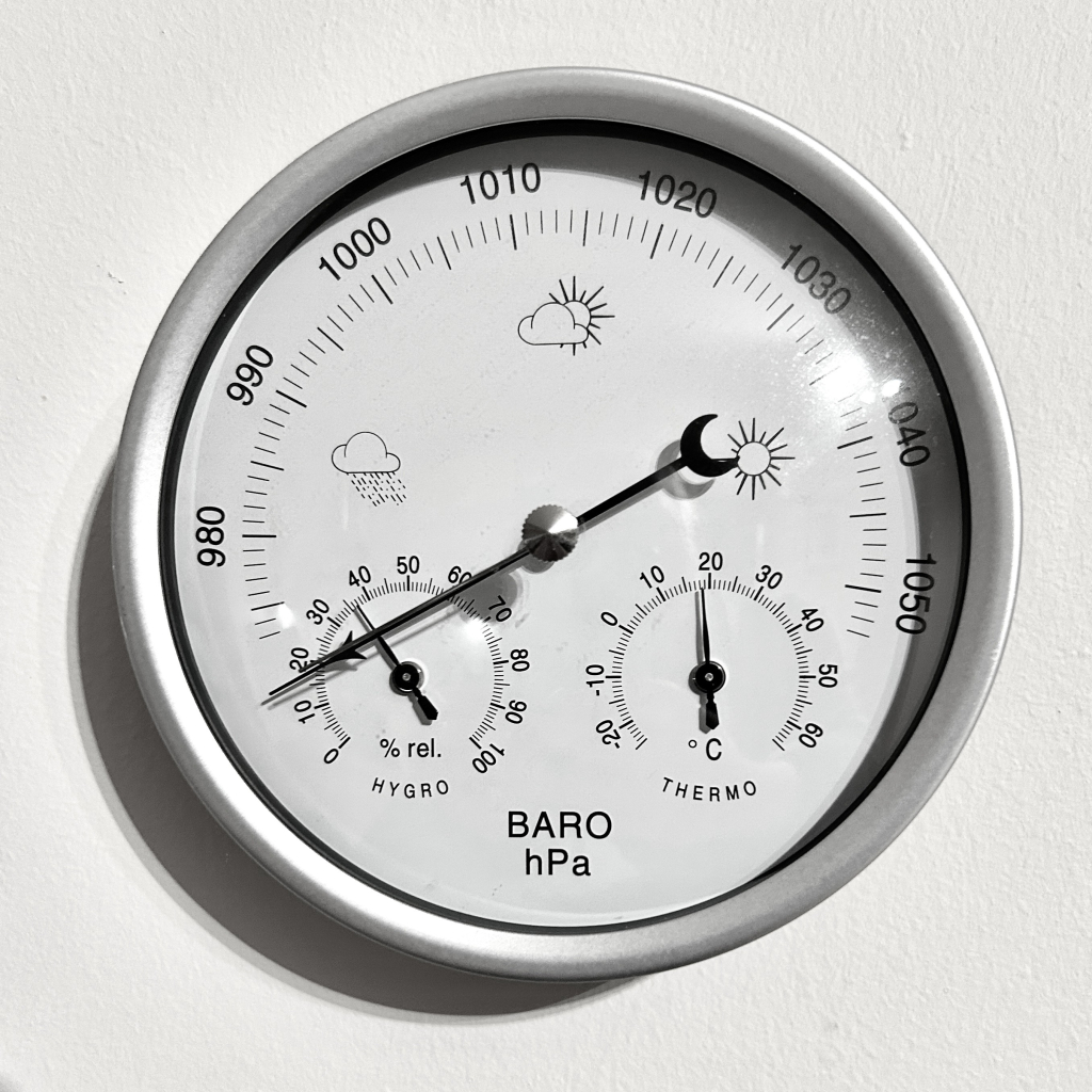 An image of a barometer with the needle for pressure pointing as low as it can go.