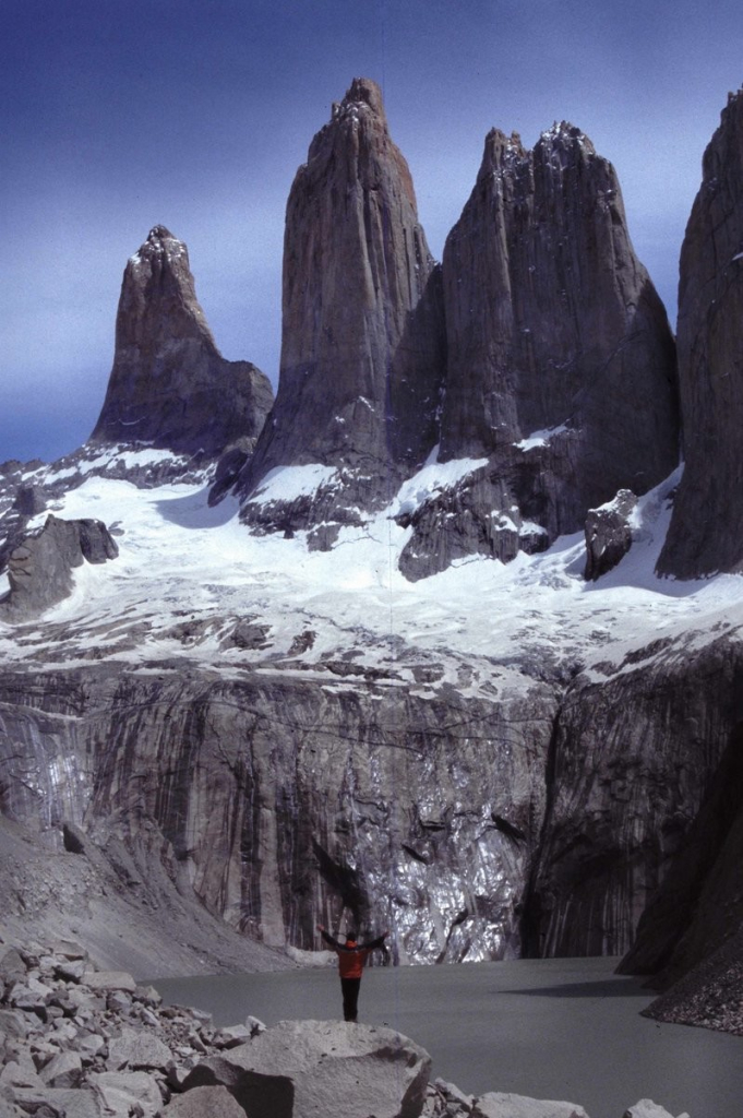 3 tooth-like peaks behind a glacier lake.