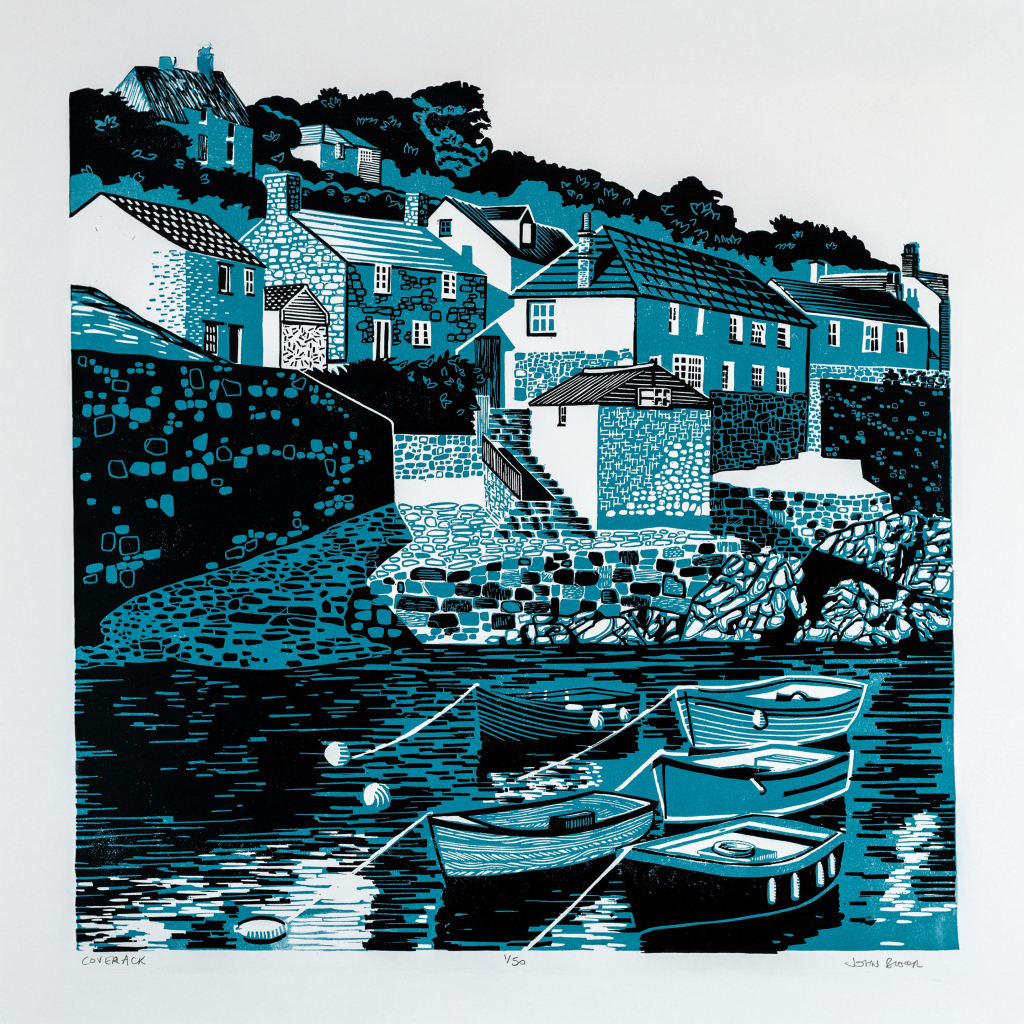 A two colour linocut print of Coverack in Cornwall, showing boats in the small harbour and houses going up the hill behind.