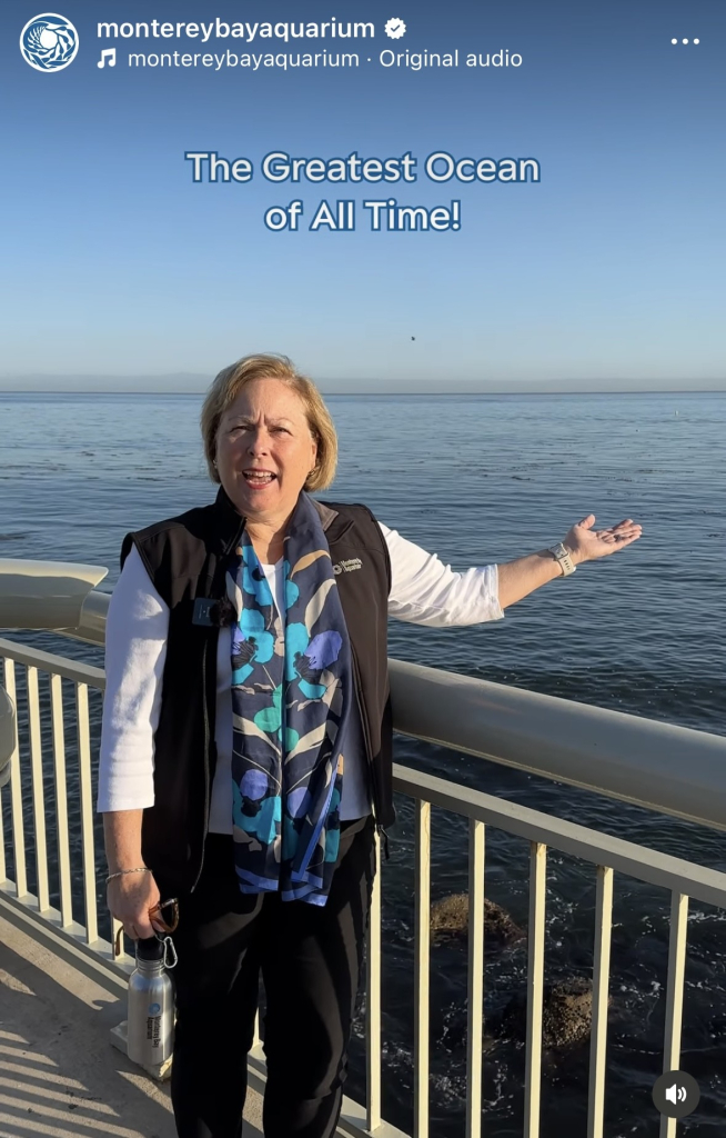 A screenshot of an Instagram post where Margaret Spring the Chief Conservation and Science Officer pointing at the bay and saying Greatest Ocean of All Time (GOAT)