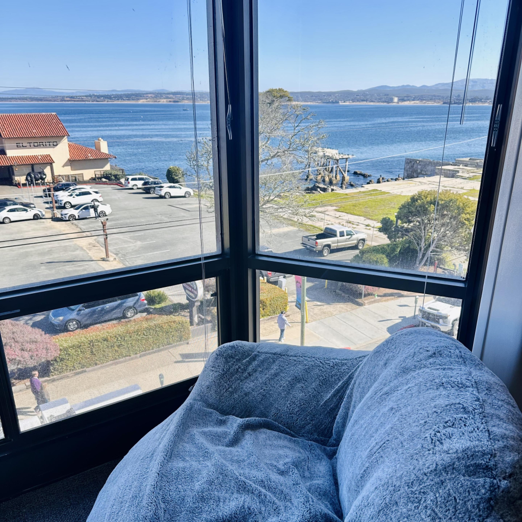 A photo of a couch right by Monterey bay 