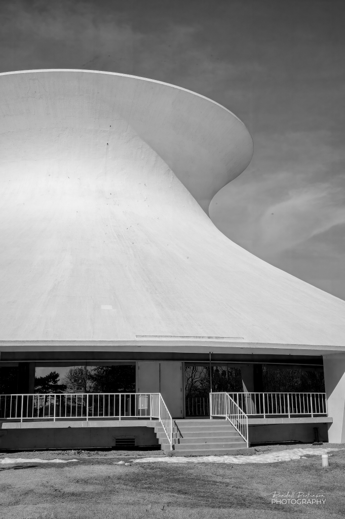 Exterior view of the McDonnell Planetarium with it's hyperboloid shaped, thin concrete shell roof.