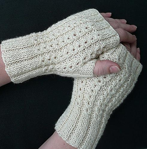 The pattern showing the finished mitts in white