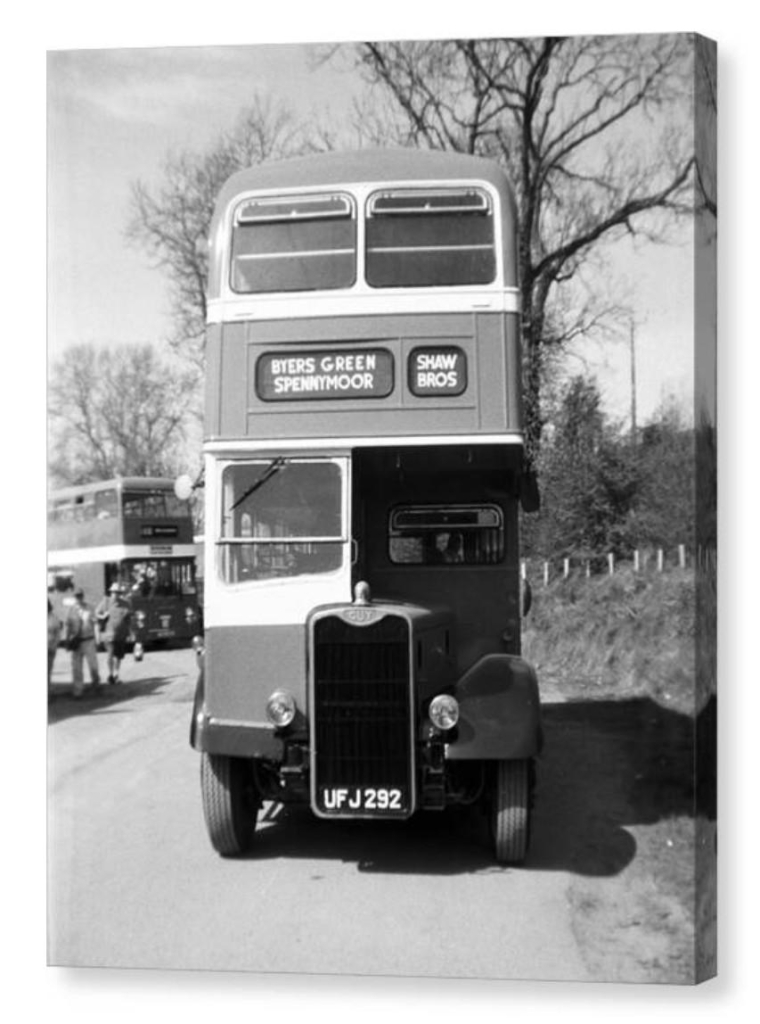 Black and white portrait photograph showing a vintage double decker bus.  The image is shown as a canvas box print.