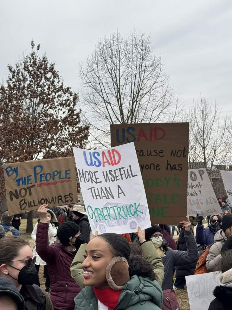 "By the people, not billionaires"  "USAID more useful than a cybertruck"