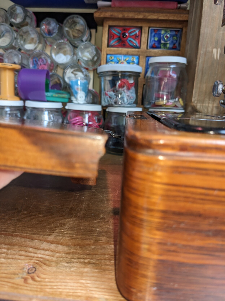 Close-up of the edges of the table part and the box base showing how one fits into the relief of the other