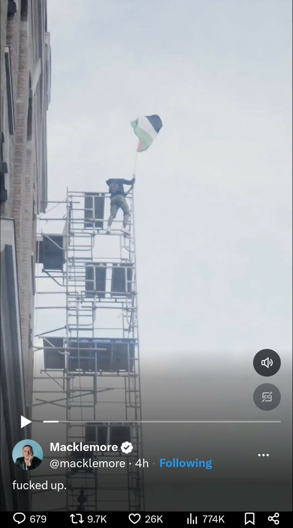 A screenshot of a tweet from musician Macklemore (@macklemore) shows a video still of a protest. In the image, a person is seen standing on top of a tall metal scaffolding structure attached to a building, waving a Palestinian flag. The sky is overcast, and the figure appears to be balancing while holding the flag high. The tweet's caption reads: "fucked up." Engagement metrics show thousands of likes, retweets, and replies.