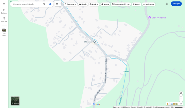 Google Maps. Few streets, two POIs, scattered houses, beyond the village — uniform, featureless green.