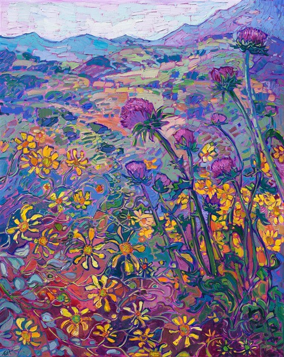 View of a very colourful hilly landscape with many white and purple flowers in the foreground 