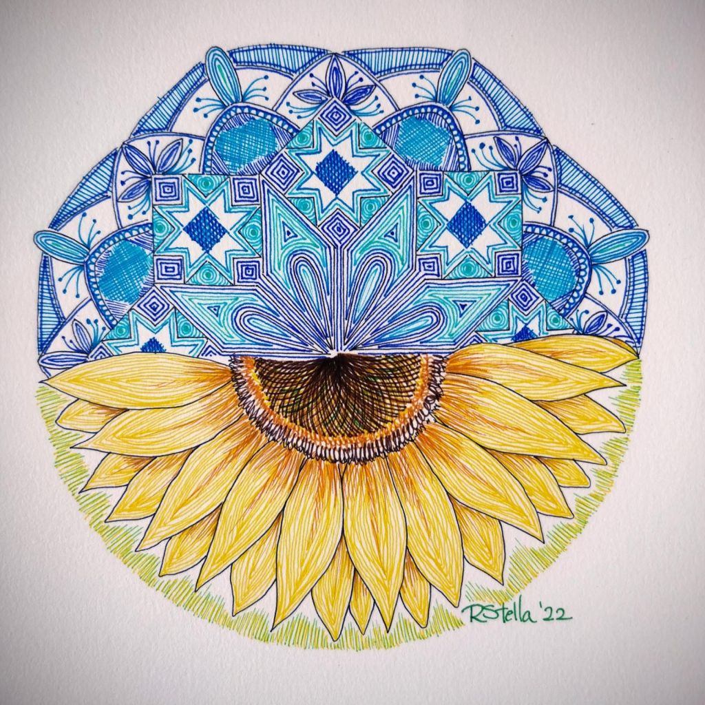 A circular drawing in coloured ink, where the blue top half is a variety of geometric designs inspired by Ukrainian embroidery patterns, and the bottom half is a yellow sunflower. 