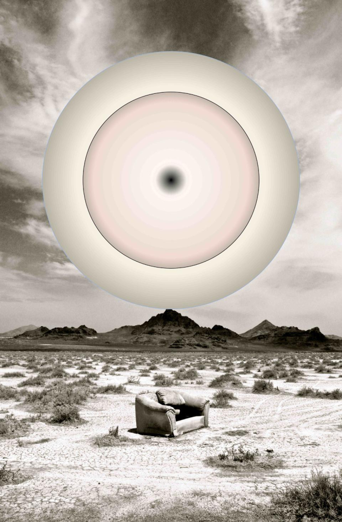 Black and white photo of desert expanse with a low mountain range in the background and scrub brushes along the ground, and a beat-up couch in the center. Over the scene floats a large circle with soft concentric circles in white, grey, and light pink.