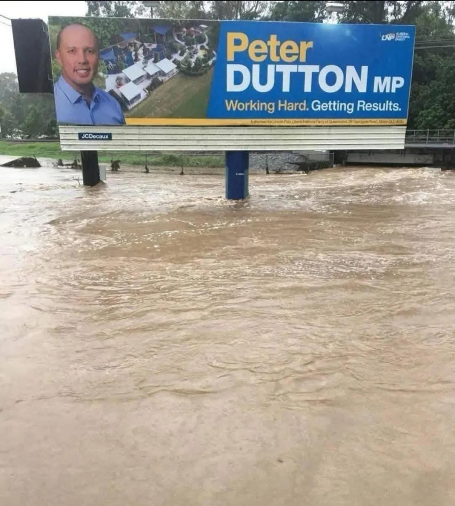 A billboard for Peter Dutton in rising floodwaters. 