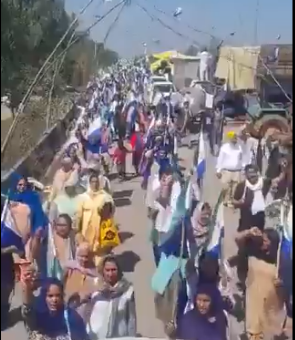 Women marching along the road in Gujarat