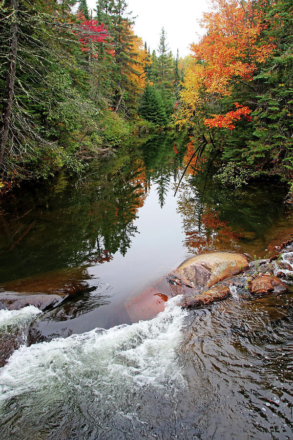 Chikanishing River in fall with great colorful foliage, rushing river and reflections