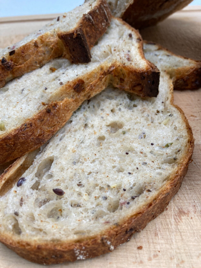 Crumb shots of my multi-seeded sourdough using a rye starter, 8% scalded home milled red Lammas flour, 6% scalded rye, 6% milled mixed pulses, 80% very strong white Canadian flour + chopped rosemary, 60g mixed seed & dried flowers. 
#sourdough #bread #breadposting #flour #milling #canadian #rosemary  #redlammas #rye #pulses #driedflowers