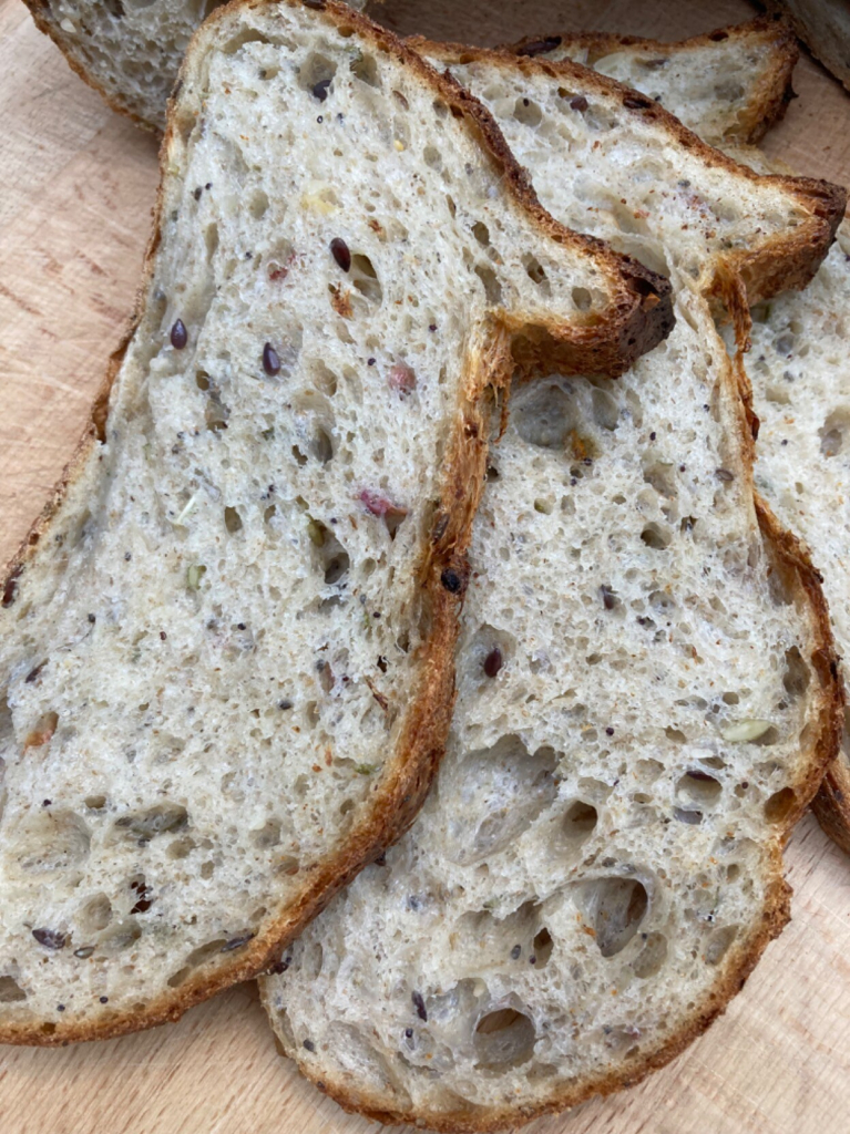 Crumb shots of my multi-seeded sourdough using a rye starter, 8% scalded home milled red Lammas flour, 6% scalded rye, 6% milled mixed pulses, 80% very strong white Canadian flour + chopped rosemary, 60g mixed seed & dried flowers. 
#sourdough #bread #breadposting #flour #milling #canadian #rosemary  #redlammas #rye #pulses #driedflowers