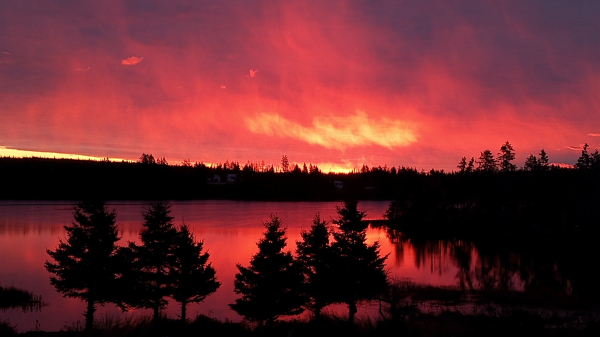 Bright Red sky over the ocean 