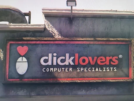 sign for a business: the logo is a computer  mouse with a red heart over it and the wordmark is: clicklovers (though it looks like the cl is a d) - computer specialists