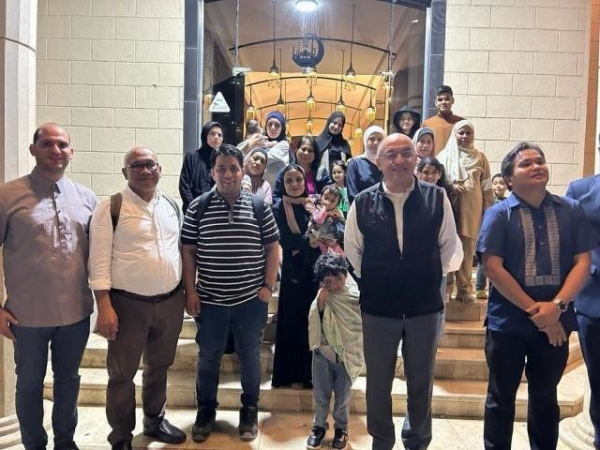 Some of the 40 Filipinos who were able to exit Gaza via Rafah Crossing pose with officials and personnel of the Philippine Embassy in Egypt, after they safely crossed the border on Wednesday, November 8, 2023 (PH time). The Filipinos will be brought to Cairo from where they will take flights back home to the Philippines. Photo courtesy: DFA/OUMWA