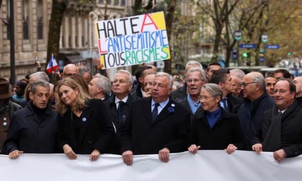 Nicolas Sarkozy, a former president; Yaël Braun-Pivet, president of France’s national assembly; Gérard Larcher, speaker of the senate; Élisabeth Borne, the prime minister, and François Hollande, another former president, at the march on Sunday. Photograph: Claudia Greco/Reuters