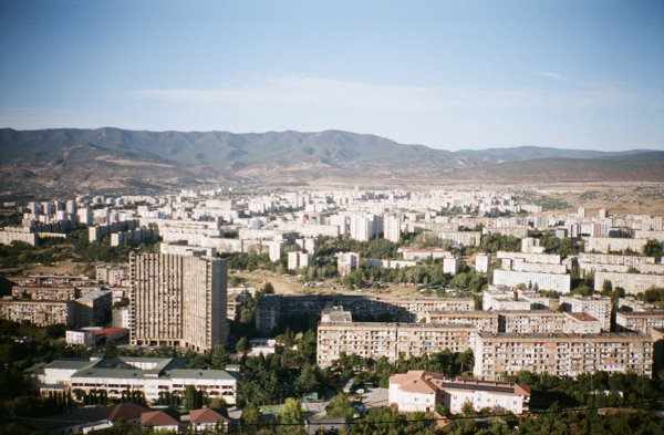 view of the tbilisi skyline in 35mm film. so many brutalist buildings