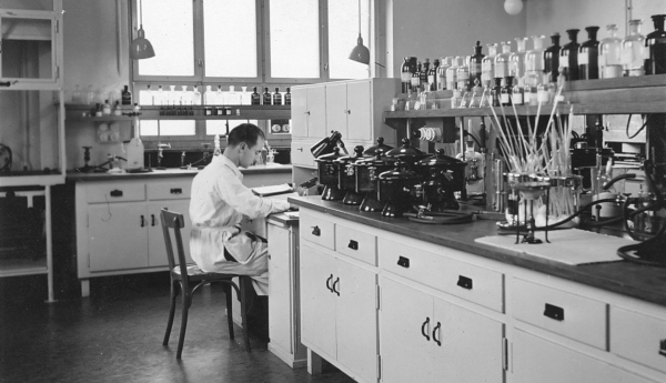 Young Albert Hofmann working at his desk at Sandoz Laboratories in Basel, Switzerland.