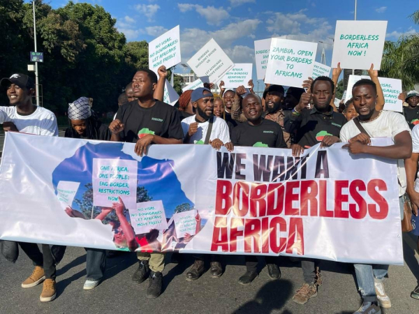 Pan-Africanists marching in the Zambian capital with borderless posts  Lusaka, demanding a united and borderless Africa.