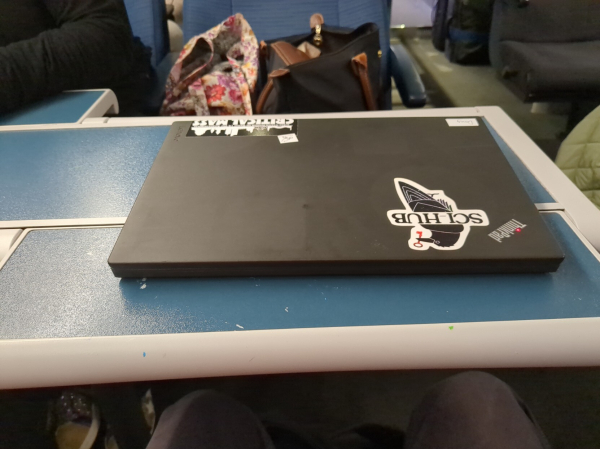 My trusty laptop on yet another train table. This one has foldy-outy extensions, like little wings.