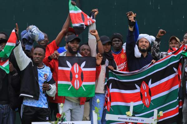 Kenyans displaying flags during concerts to commemorate the victims of police brutality 