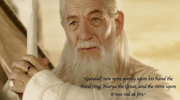 gandalf the white holding staff and wearing a gold ring with a large red stone: "Gandalf now wore opening on his hand the third ring Narya the Great and the stone upon it was red as fire."