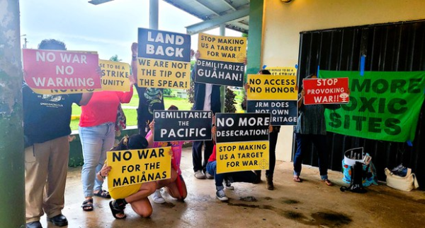 Guamanians protesting their US military occupation and imperialism