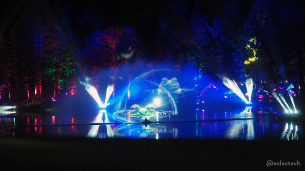 Photo of the projection on the loch, showing large frogs peeking out of the water.