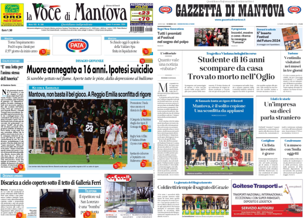 L'immagine mostra due prime pagine di giornali affiancate. A sinistra c'è "La Voce di Mantova" e a destra "Gazzetta di Mantova". Entrambi i giornali riportano notizie principali riguardanti un sedicenne trovato morto, con ipotesi di suicidio.   "La Voce di Mantova" ha un titolo principale che recita: "Muore annegato a 16 anni. Ipotesi suicidio". Sotto il titolo c'è una foto di una partita di calcio con la didascalia "Mantova, non basta il bel gioco. A Reggio Emilia sconfitta di rigore".   La "Gazzetta di Mantova" ha come titolo principale: "Studente di 16 anni scompare da casa. Trovato morto nell'Oglio". Sotto il titolo c'è una foto di una squadra di pallavolo con la didascalia "Volley, il Vbc vince e resta nei playoff".  Entrambi i giornali presentano altre notizie e immagini minori, ma le informazioni principali riguardano l'evento tragico del giovane trovato morto.  .