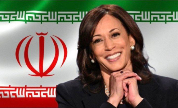 Picture from Hebrew channel with flag of Iran behind Kamala Harris looking happy 