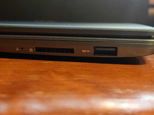 A view of the laptop's right hand side showing a USB 3.0 and 8-pin debugging interface.