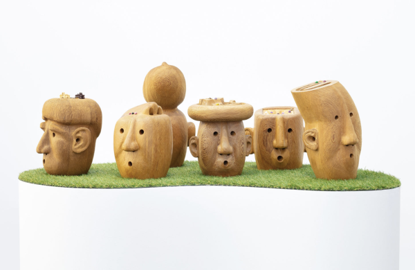 Assortment of sculptural wooden heads with surprised faces