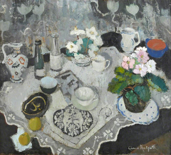 Painting of a dark table covered with a white lace cloth, laden with tea cups, vases of flowers, fruit, bottles, and jugs