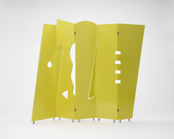 Tall, bright yellow-green folding screen with diagonal edges and geometric shape cutouts