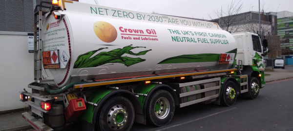 Tanker lorry with labelling:
"Crown Oil, The UK's first carbon neutral fuel supplier".