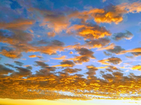 A picture of a cloudy horizon at sunset.