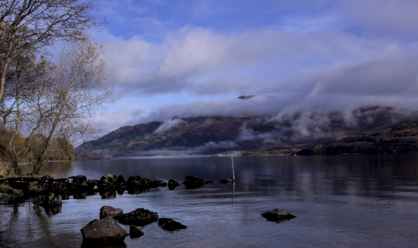 Loch Lomond with patches of mist on slopes of Beinn Laomainn