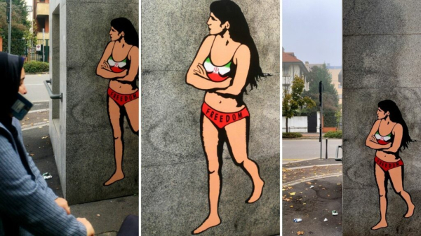 Photo of a mural of Ahou Daryaei that appeared on a wall opposite the Iranian consulate in Milan, Italy.

Ahou is wearing a bra top in the colours of the Iranian flag and red pants with the word freedom in black. 
Mural by aleXandro Palombo