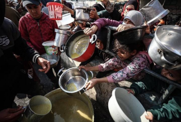 Archive image of Palestinians desperate attempt to grab food 